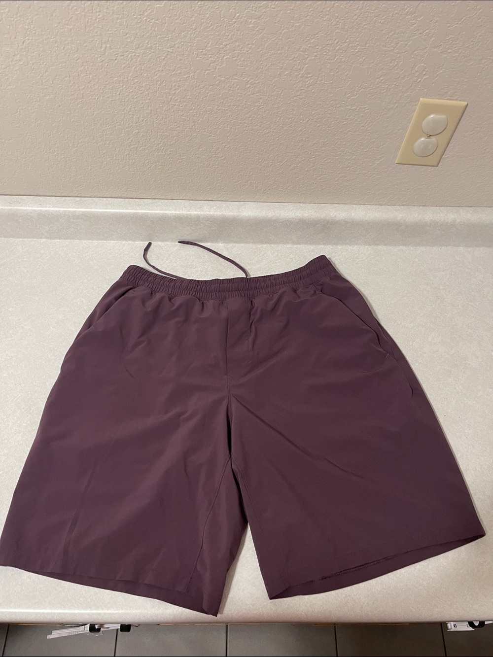 Lululemon Men's Elastic-Waist Plum Active Shorts front pockets & side zip pocket